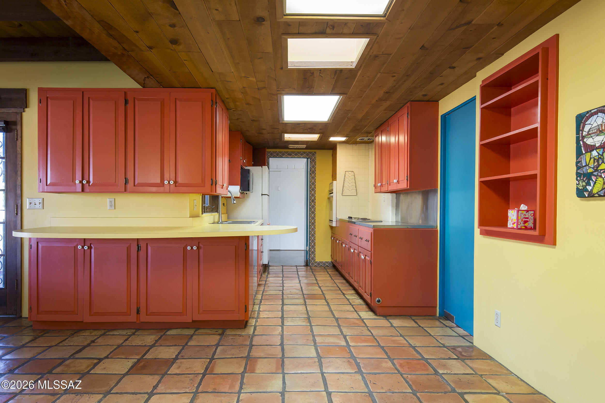 4130 East River Road Tucson, AZ 85718 - Photo 10 of 46 a kitchen with a sink cabinets and window
