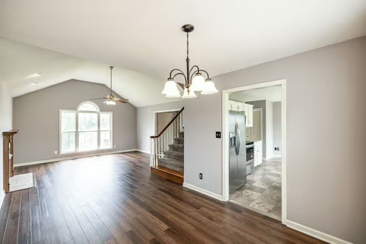 2029 Copper Kettle Circle Pleasant View, TN 37146 - Photo 19 of 58 a view interior of a house with wooden floor stairs and a chandelier