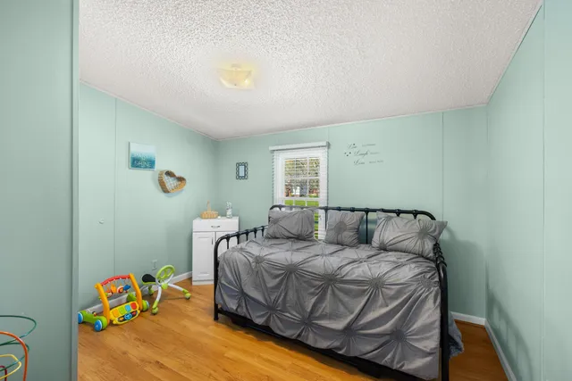 a view of a house with backyard sitting area and garden