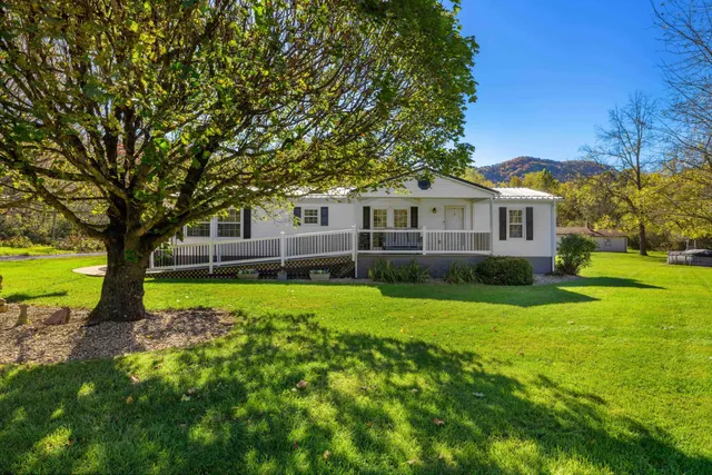 a view of a house with a big yard