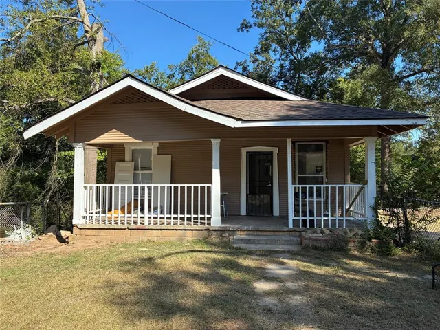 a front view of a house with deck