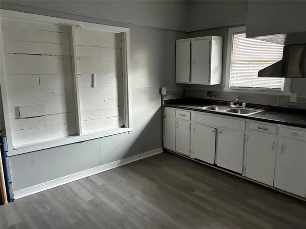 a kitchen with a sink and cabinets