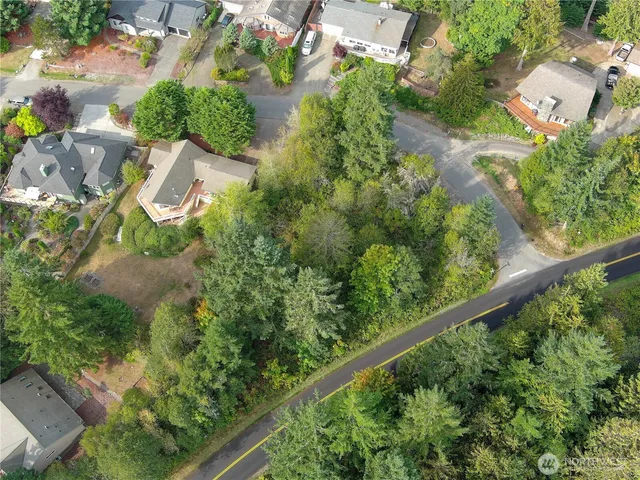 an aerial view of a residential houses with outdoor space