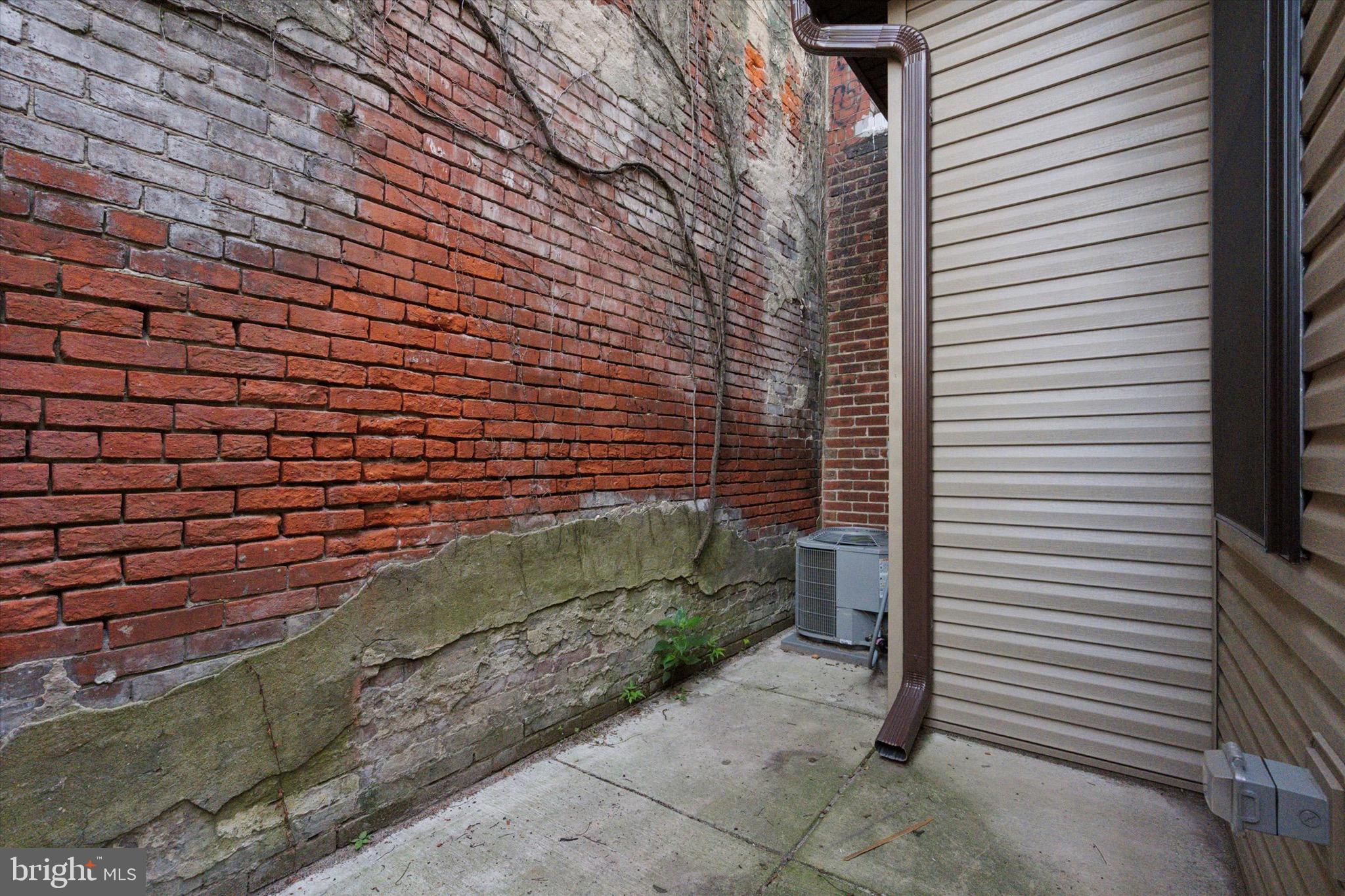 1438 Tasker Street, Unit 1 Philadelphia, PA 19145 - Photo 11 of 16 a view of a door and a yard