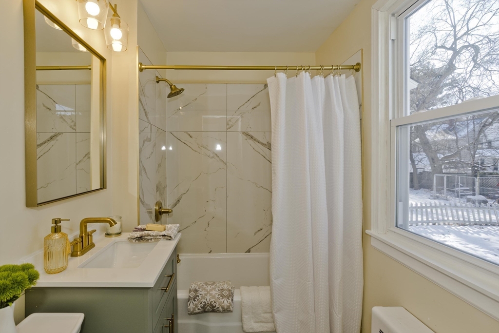 30 Parkwood Street Springfield, MA 01108 - Photo 16 of 41 a bathroom with a sink and a mirror