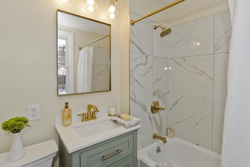 30 Parkwood Street Springfield, MA 01108 - Photo 17 of 41 a bathroom with a granite countertop sink a toilet and shower