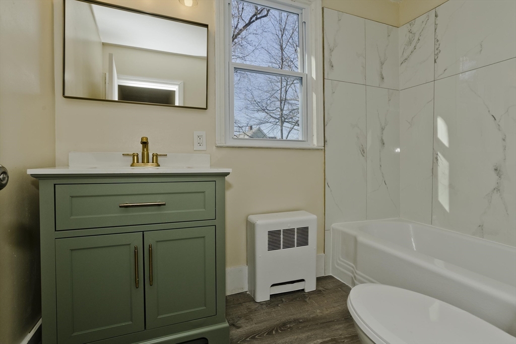 30 Parkwood Street Springfield, MA 01108 - Photo 31 of 41 a bathroom with a toilet sink and mirror