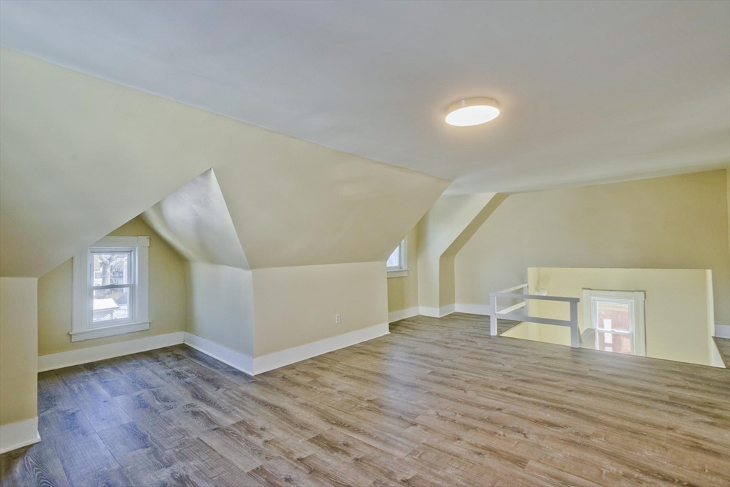 30 Parkwood Street Springfield, MA 01108 - Photo 35 of 41 wooden floor in an empty room with a window