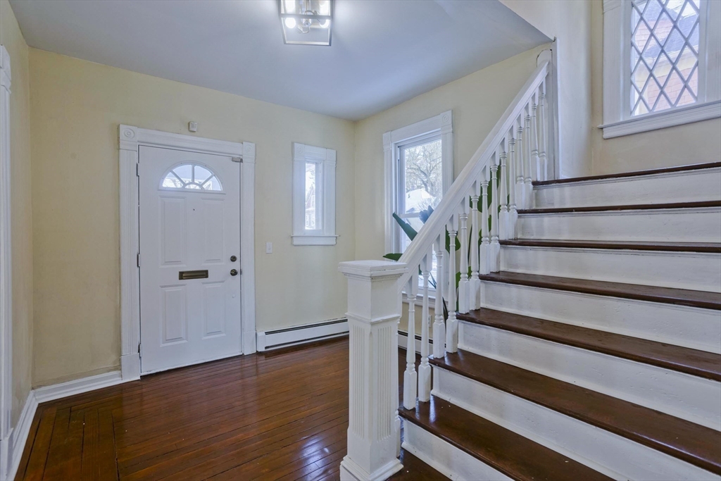 30 Parkwood Street Springfield, MA 01108 - Photo 5 of 41 a view of entryway with wooden floor and stairs