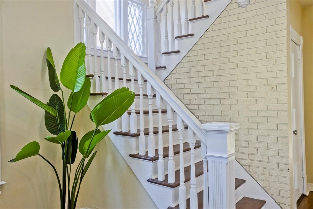 30 Parkwood Street Springfield, MA 01108 - Photo 6 of 41 a view of staircase with railing and a potted plant
