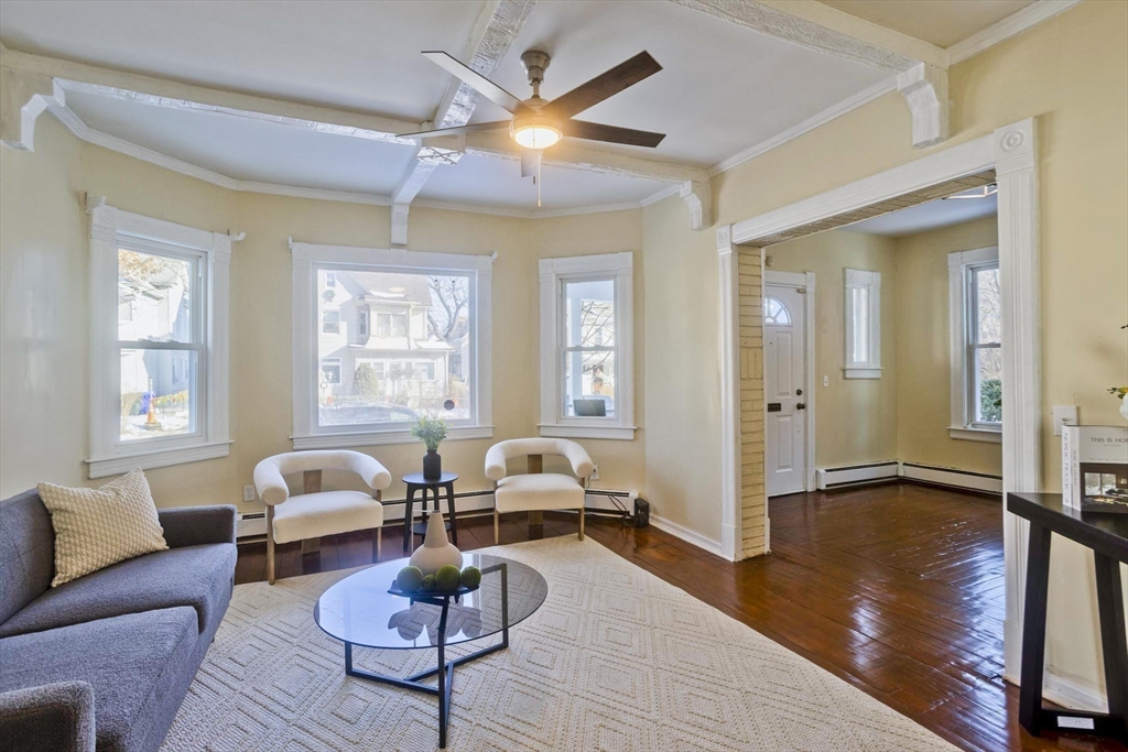 30 Parkwood Street Springfield, MA 01108 - Photo 10 of 41 a living room with furniture a window and a chandelier
