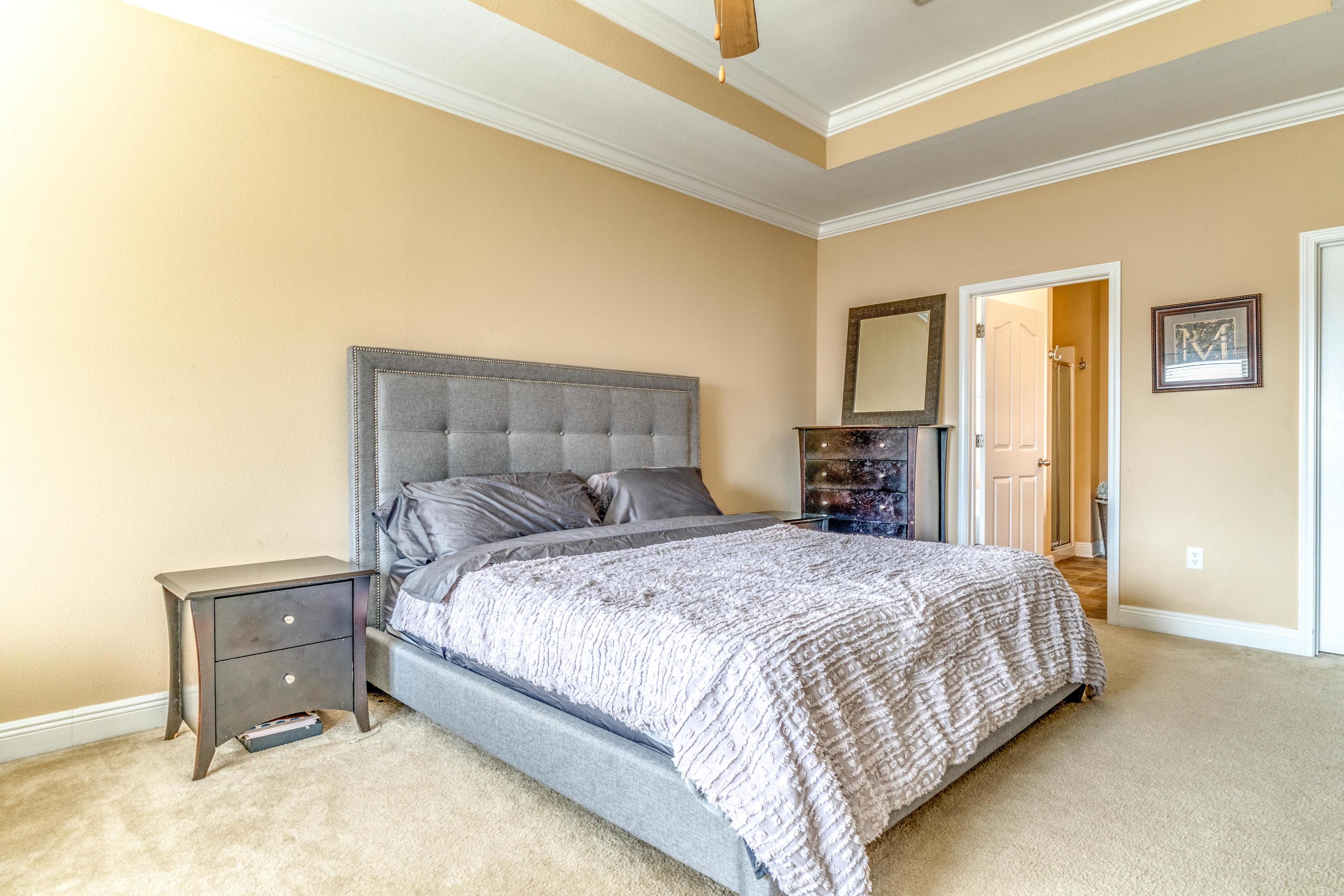 730 Lime Lane Crestview, FL 32536 - Photo 16 of 25 a bedroom with a bed and wooden floor