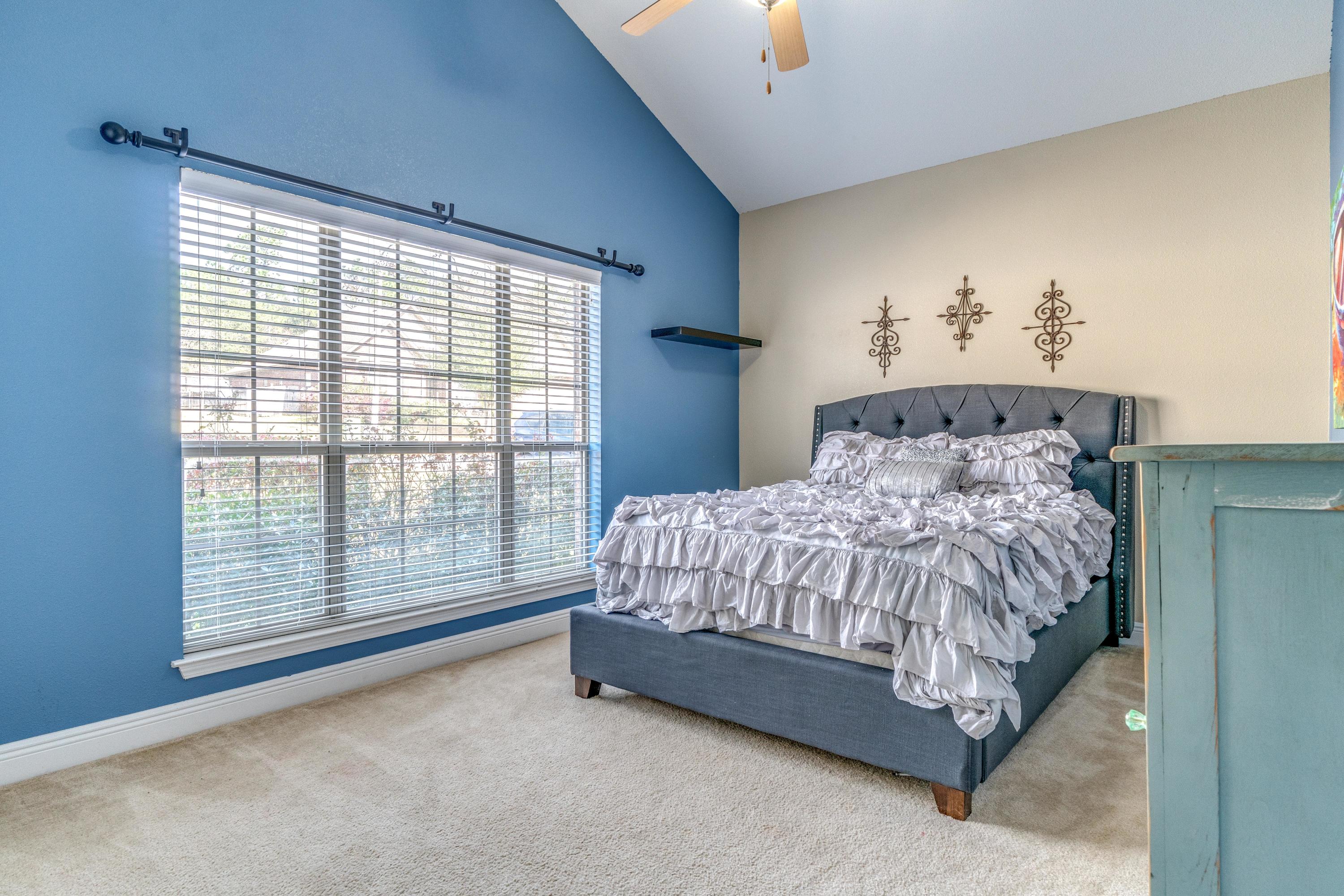 730 Lime Lane Crestview, FL 32536 - Photo 19 of 25 a bed sitting in a bedroom next to a window