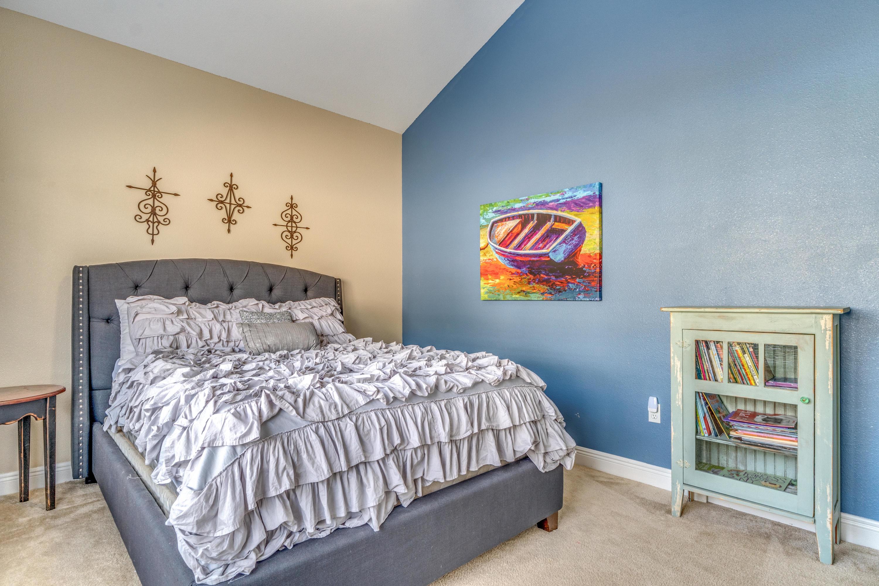 730 Lime Lane Crestview, FL 32536 - Photo 20 of 25 a bedroom with a bed and a painting on the wall