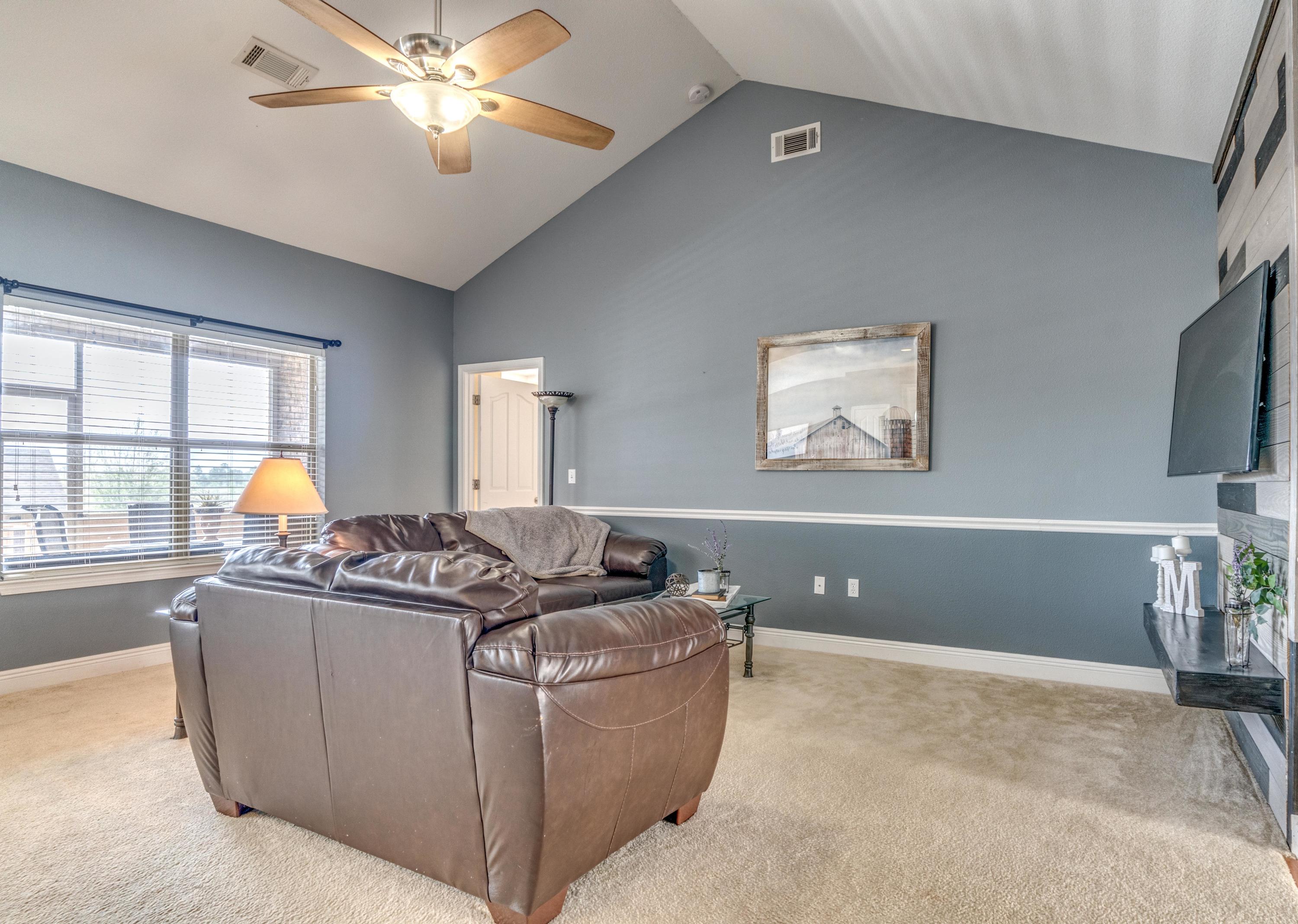 730 Lime Lane Crestview, FL 32536 - Photo 7 of 25 a living room with furniture and a flat screen tv