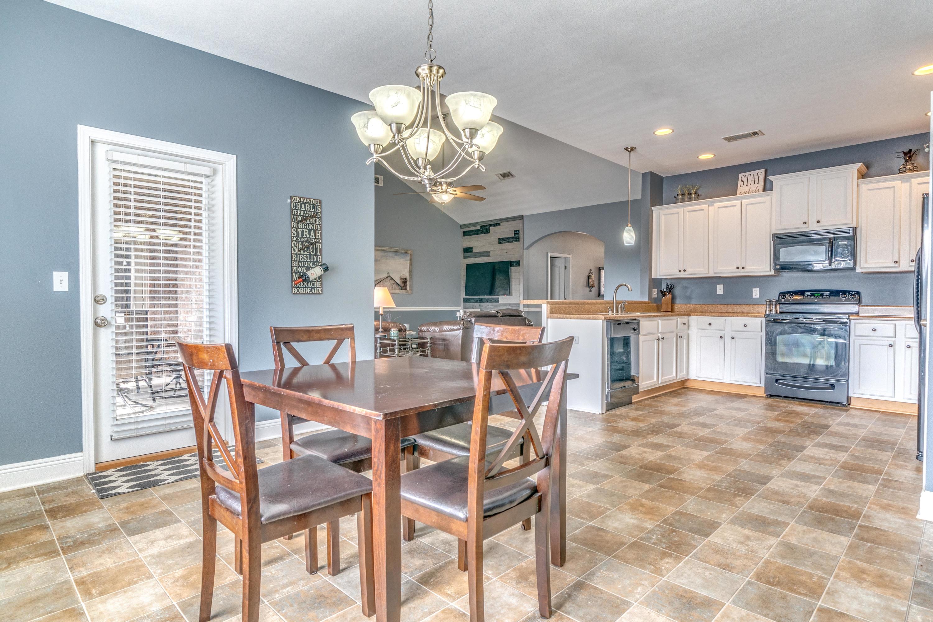 730 Lime Lane Crestview, FL 32536 - Photo 9 of 25 a view of a dining room with furniture and chandelier