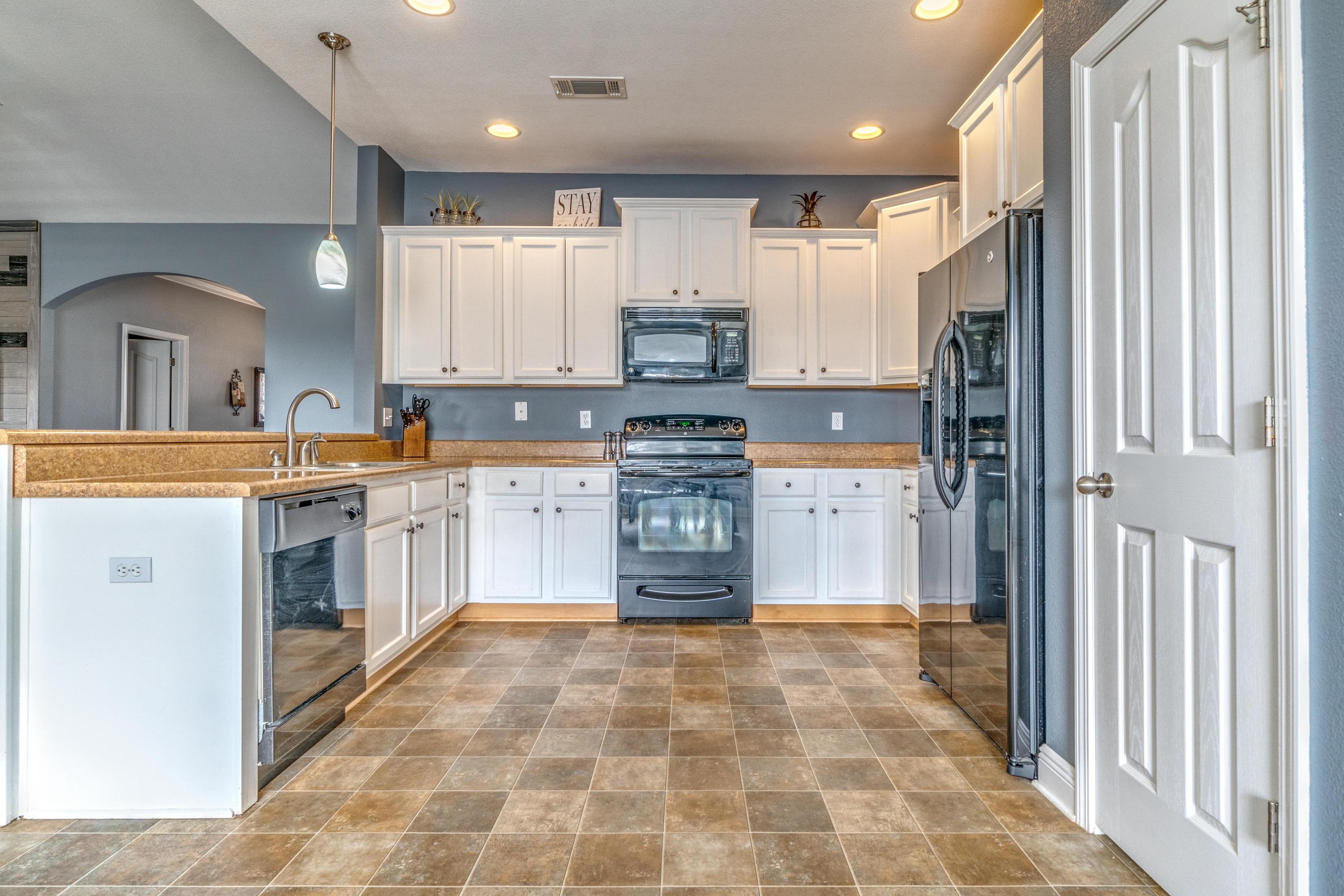 730 Lime Lane Crestview, FL 32536 - Photo 10 of 25 a kitchen with stainless steel appliances granite countertop a refrigerator and a stove top oven