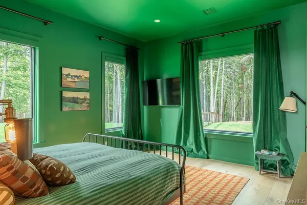 a living room with furniture and a view of kitchen