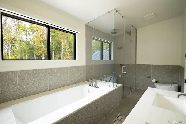a bathroom with a bathtub and a sink