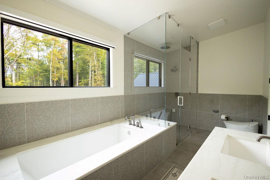 72 Van Tine Road Kerhonkson, NY 12446 - Photo 19 of 39 a bathroom with a bathtub and sink
