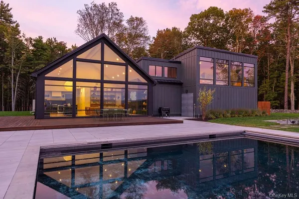 a front view of house with yard outdoor seating and green space