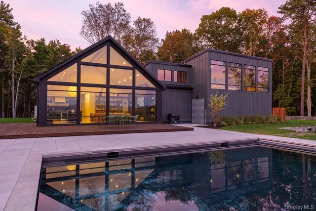 a front view of house with yard outdoor seating and green space