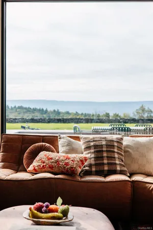 a view of backyard with a table and chairs