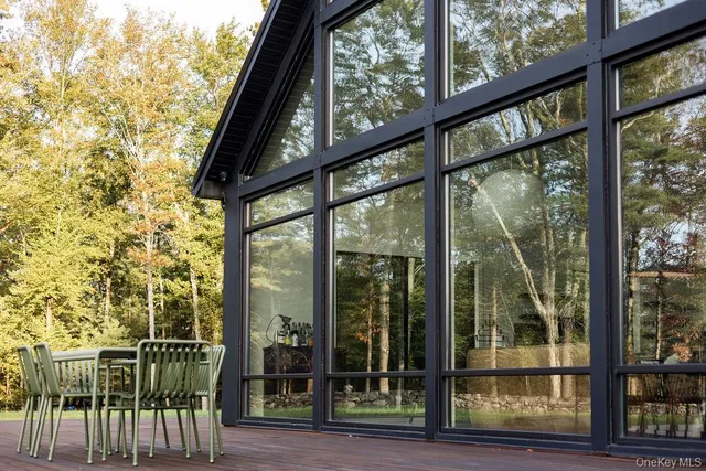 a view of house with outdoor space and sitting area