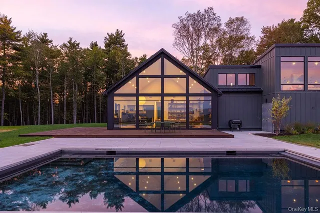 a view of swimming pool with a patio