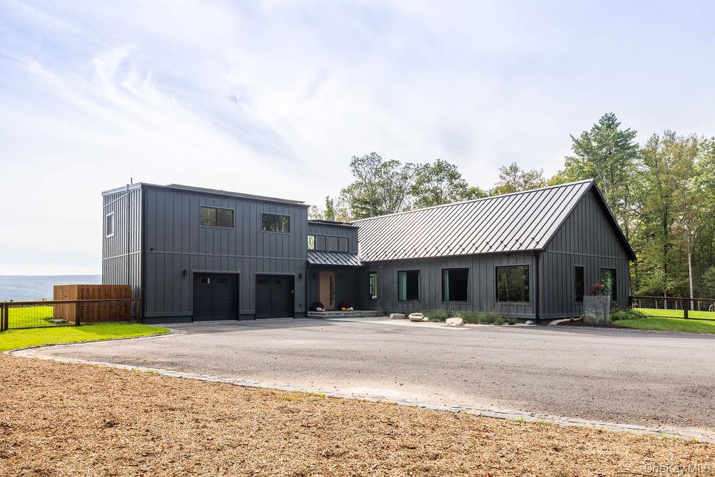72 Van Tine Road Kerhonkson, NY 12446 - Photo 4 of 39 a front view of a house with a yard