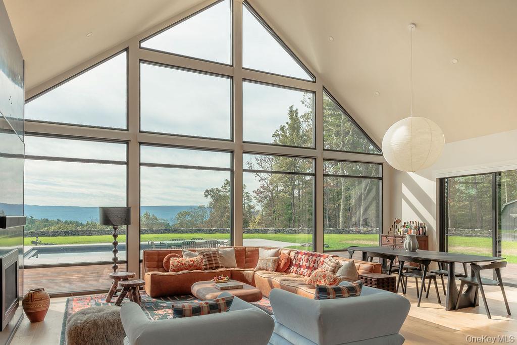 72 Van Tine Road Kerhonkson, NY 12446 - Photo 5 of 39 a living room with furniture and floor to ceiling windows