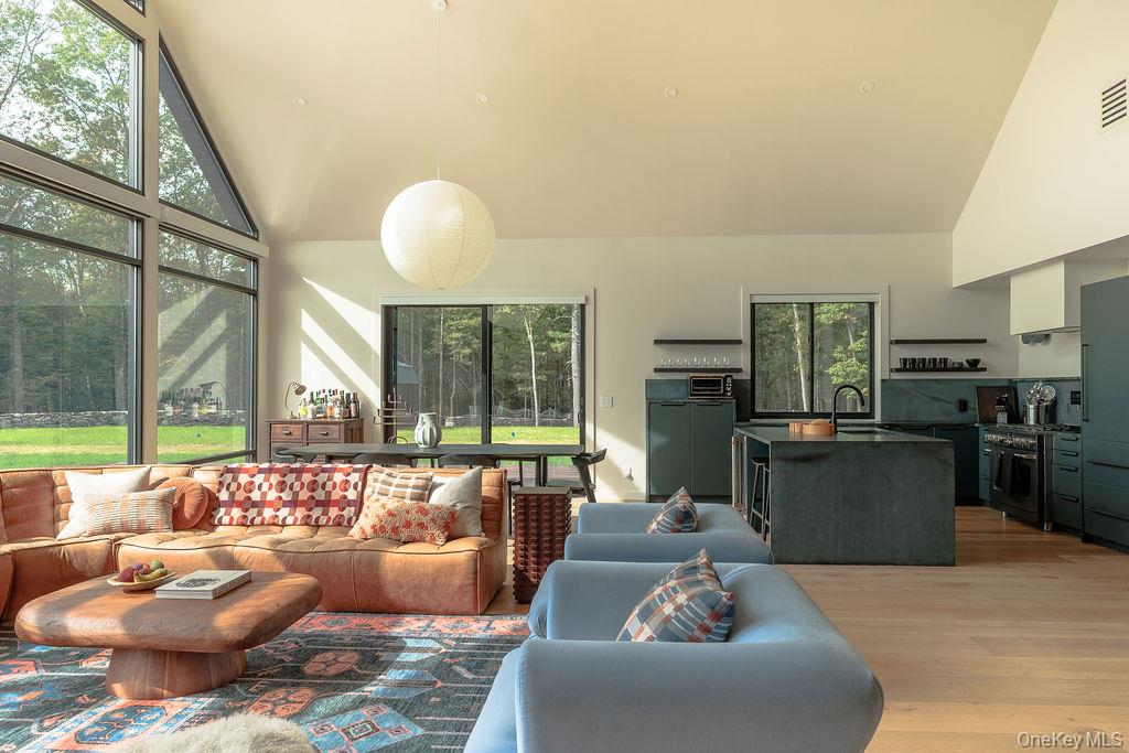 72 Van Tine Road Kerhonkson, NY 12446 - Photo 8 of 39 a living room with furniture and a large window