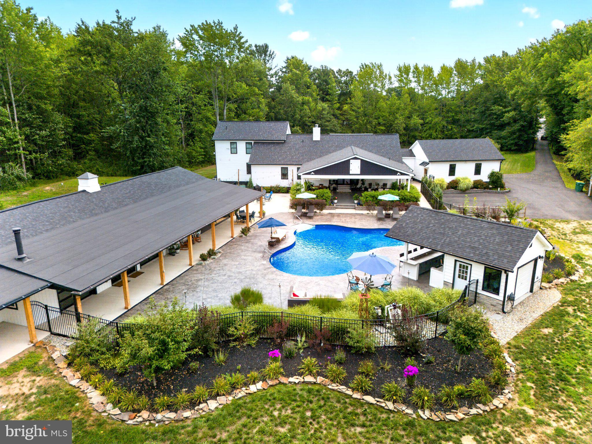 57 Island Road Monroeville, NJ 08343 - Photo 10 of 82 Serene oasis with pool and greenery.