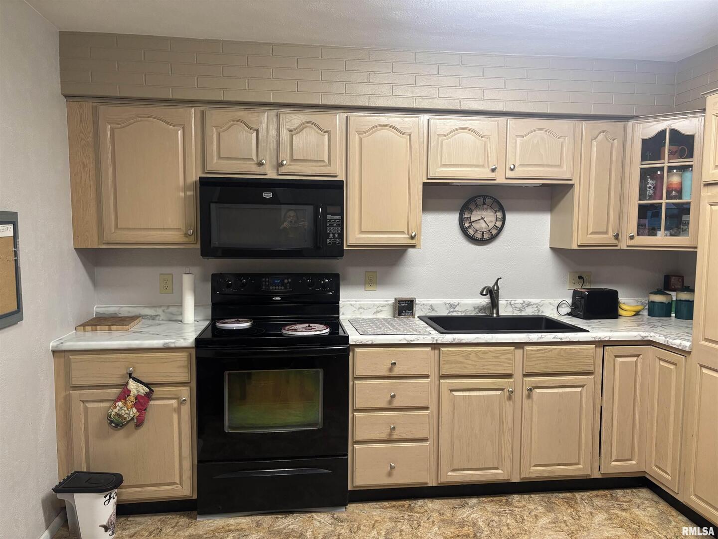 434 Payson Street Kewanee, IL 61443 - Photo 13 of 38 a kitchen with granite countertop white cabinets and stainless steel appliances