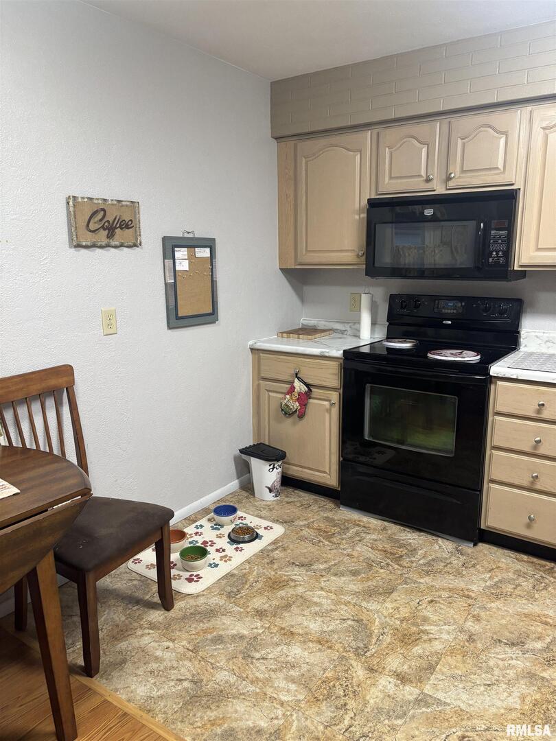 434 Payson Street Kewanee, IL 61443 - Photo 14 of 38 a bedroom with a bed and a television