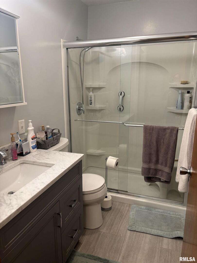 434 Payson Street Kewanee, IL 61443 - Photo 24 of 38 a bathroom with a sink a toilet and a shower