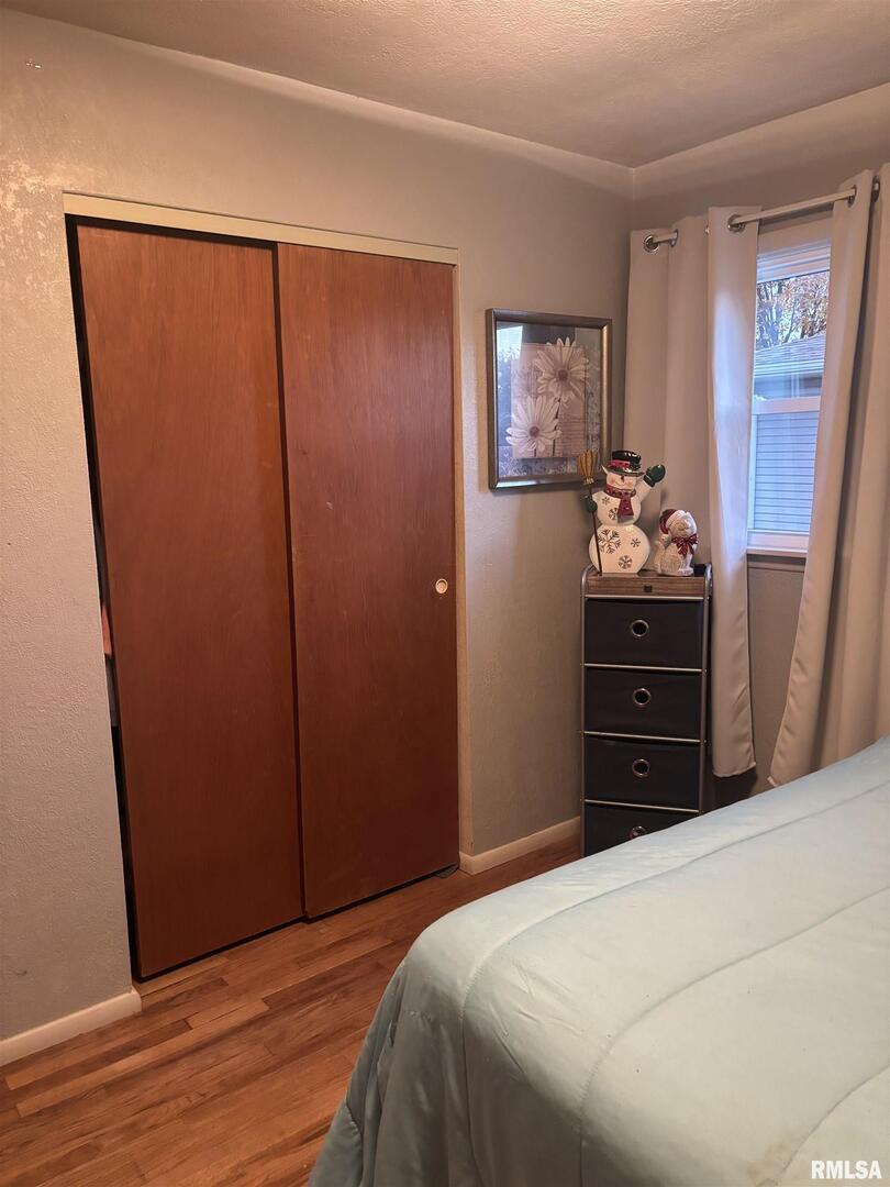 434 Payson Street Kewanee, IL 61443 - Photo 26 of 38 a bedroom with a bed and cabinet