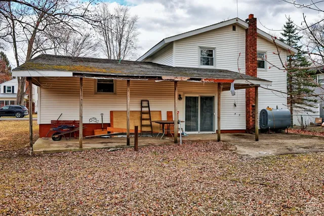 a street view covered with snow and trees