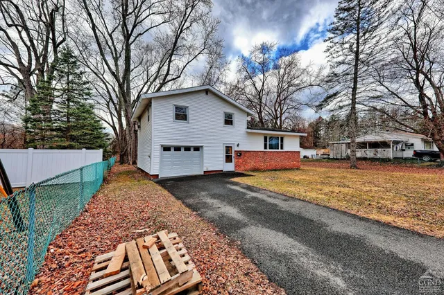a view of large house with a yard