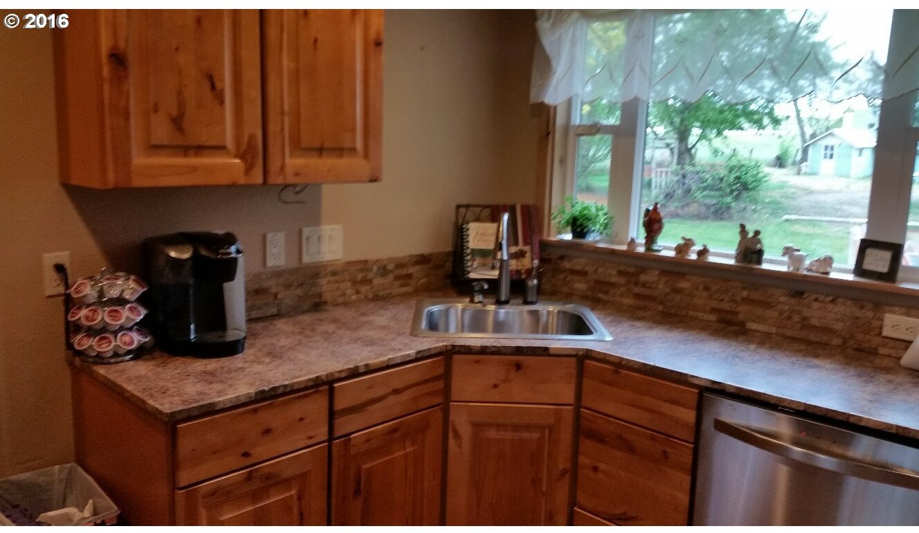 77862 North Ash Road Stanfield, OR 97875 - Photo 2 of 28 a kitchen with a sink and cabinets