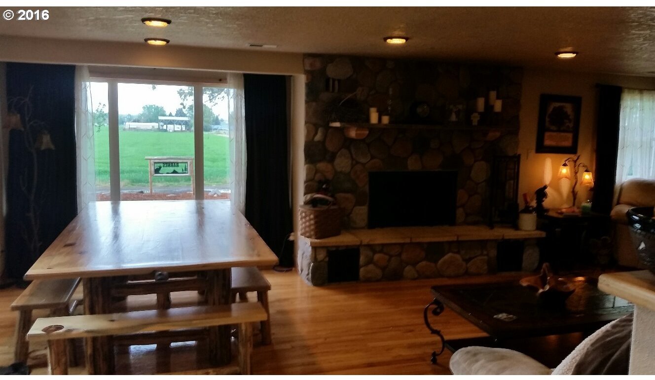 77862 North Ash Road Stanfield, OR 97875 - Photo 5 of 28 a living room with furniture and a fireplace
