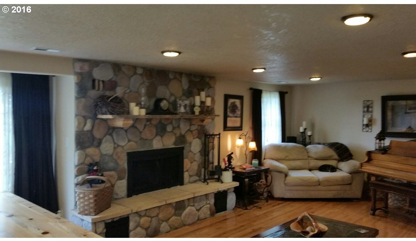77862 North Ash Road Stanfield, OR 97875 - Photo 7 of 28 a living room with furniture and a fireplace