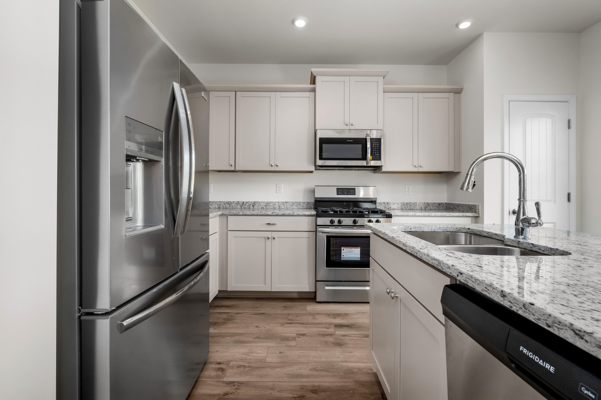 106 Keystone Road Shelbyville, TN 37160 - Photo 10 of 33 a kitchen with stainless steel appliances granite countertop a refrigerator sink and stove