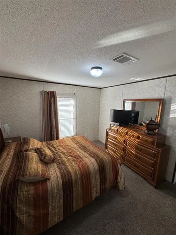 a en suite bathroom with a double vanity sink and a mirror