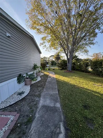a view of a yard with swimming pool