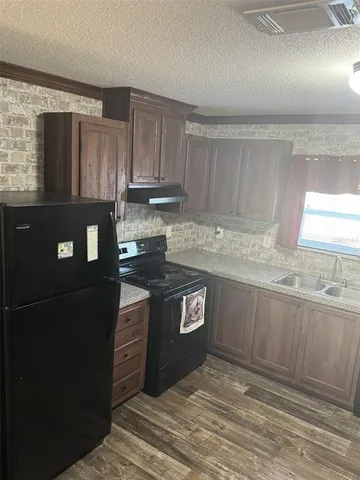 a view of kitchen with furniture and window