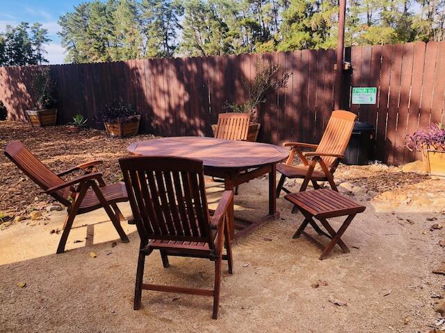 100 Den Street Los Alamos, CA 93440 - Photo 5 of 10 a backyard of a house with table and chairs