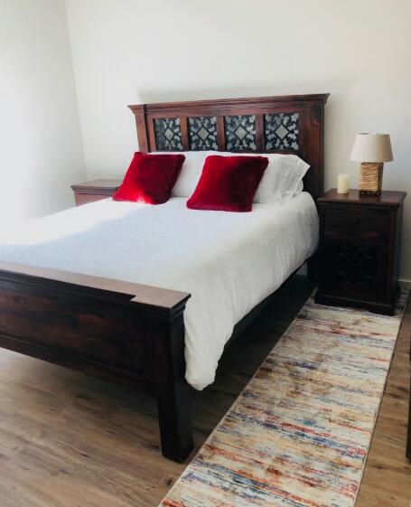 100 Den Street Los Alamos, CA 93440 - Photo 7 of 10 a bedroom with a bed and a night stand