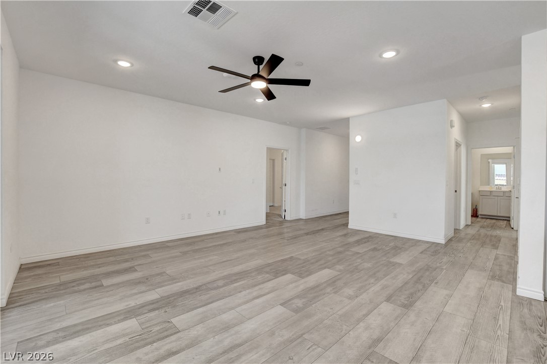 2555 Hampton Road, Unit 2207 Henderson, NV 89052 - Photo 8 of 74 A spacious living area offers bright recessed lighting and light wood flooring.