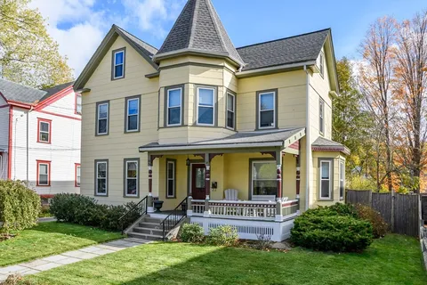 front view of a house with a yard